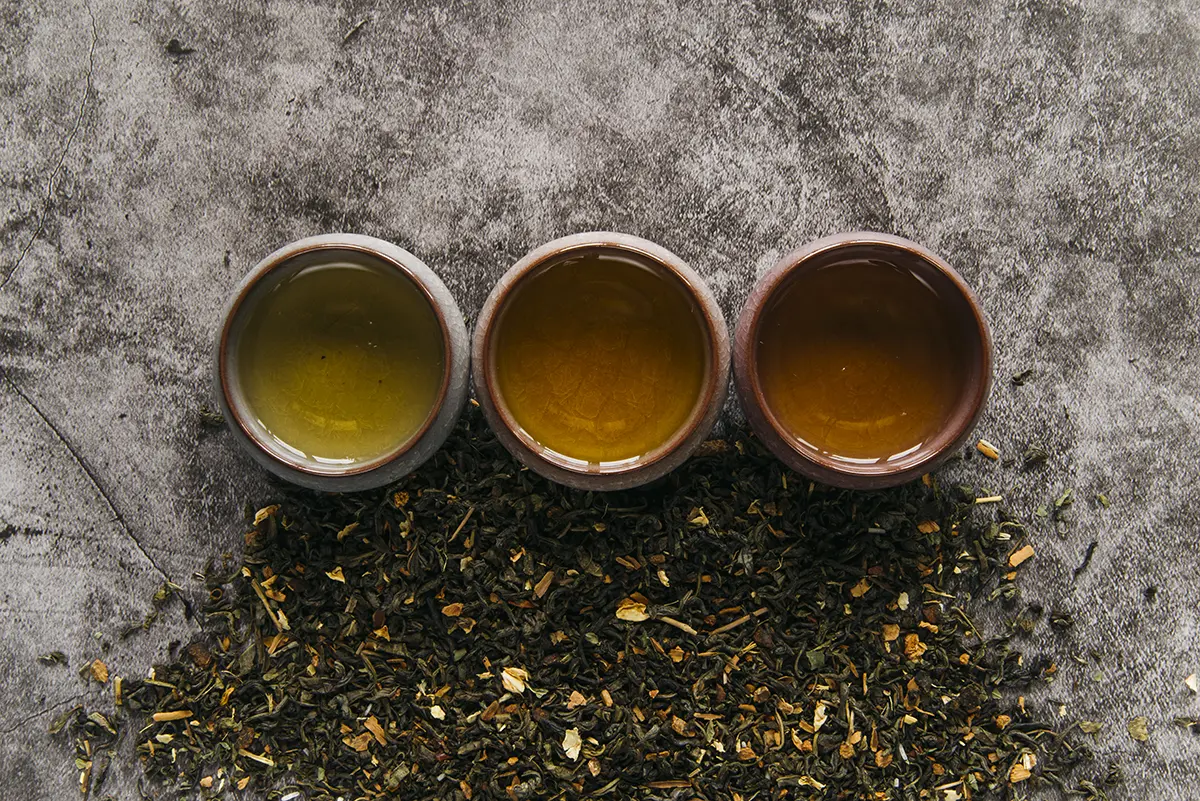 herbal-chinese-teacup-with-dried-tea-herb-concrete-backdrop